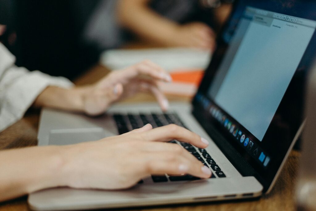 woman typing on a laptop