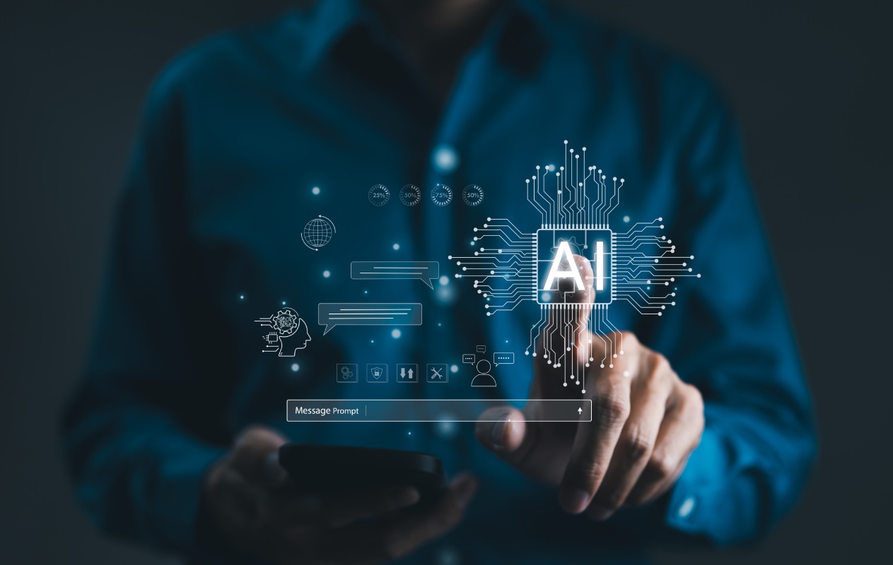 A person in a blue shirt uses a smartphone, with a holographic AI interface floating above. The visual conveys a futuristic tech atmosphere.